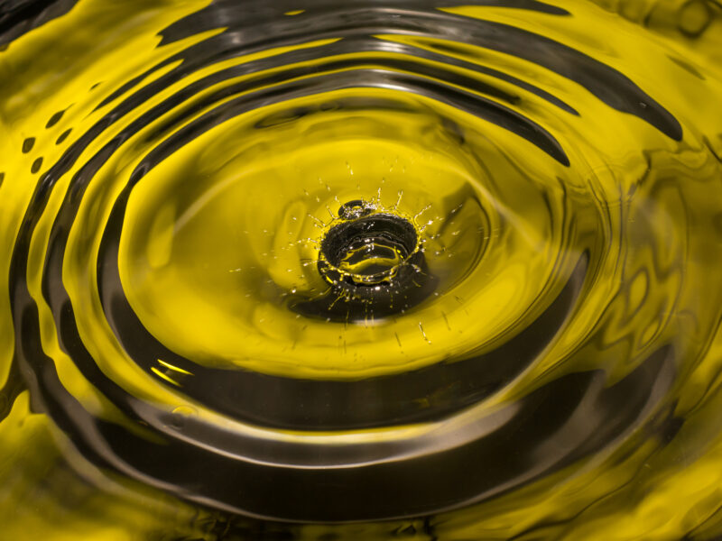 Ripple effect in a pool of yellow biodiesel oil representing renewable energy feedstocks