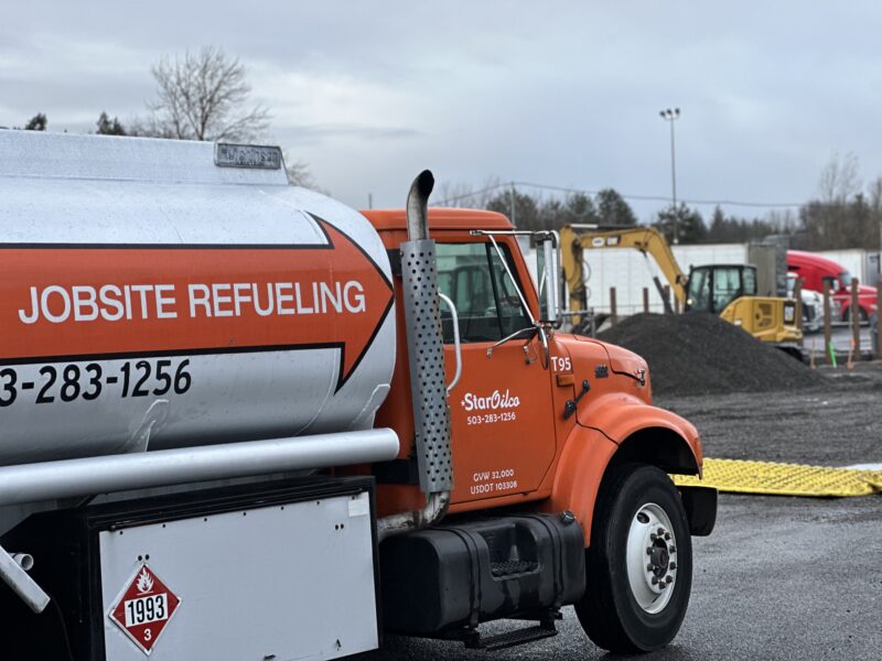 Star Oilco technician testing off-road diesel fuel quality with a funnel and filter on-site in Portland OR
