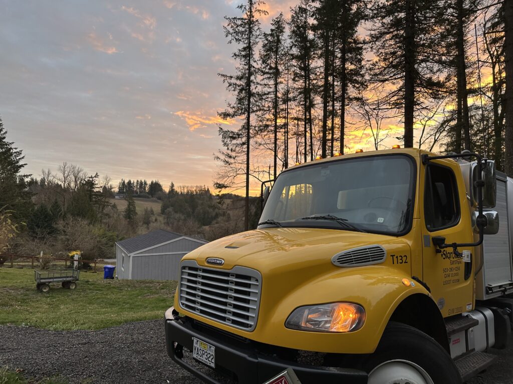 Yellow Star Oilco truck at sunrise on a rural Oregon property