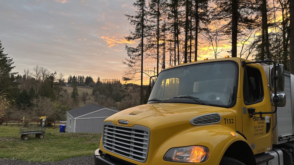 Yellow Star Oilco truck at sunrise on a rural Oregon property