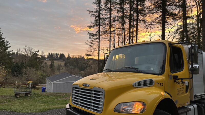 Yellow Star Oilco truck at sunrise on a rural Oregon property